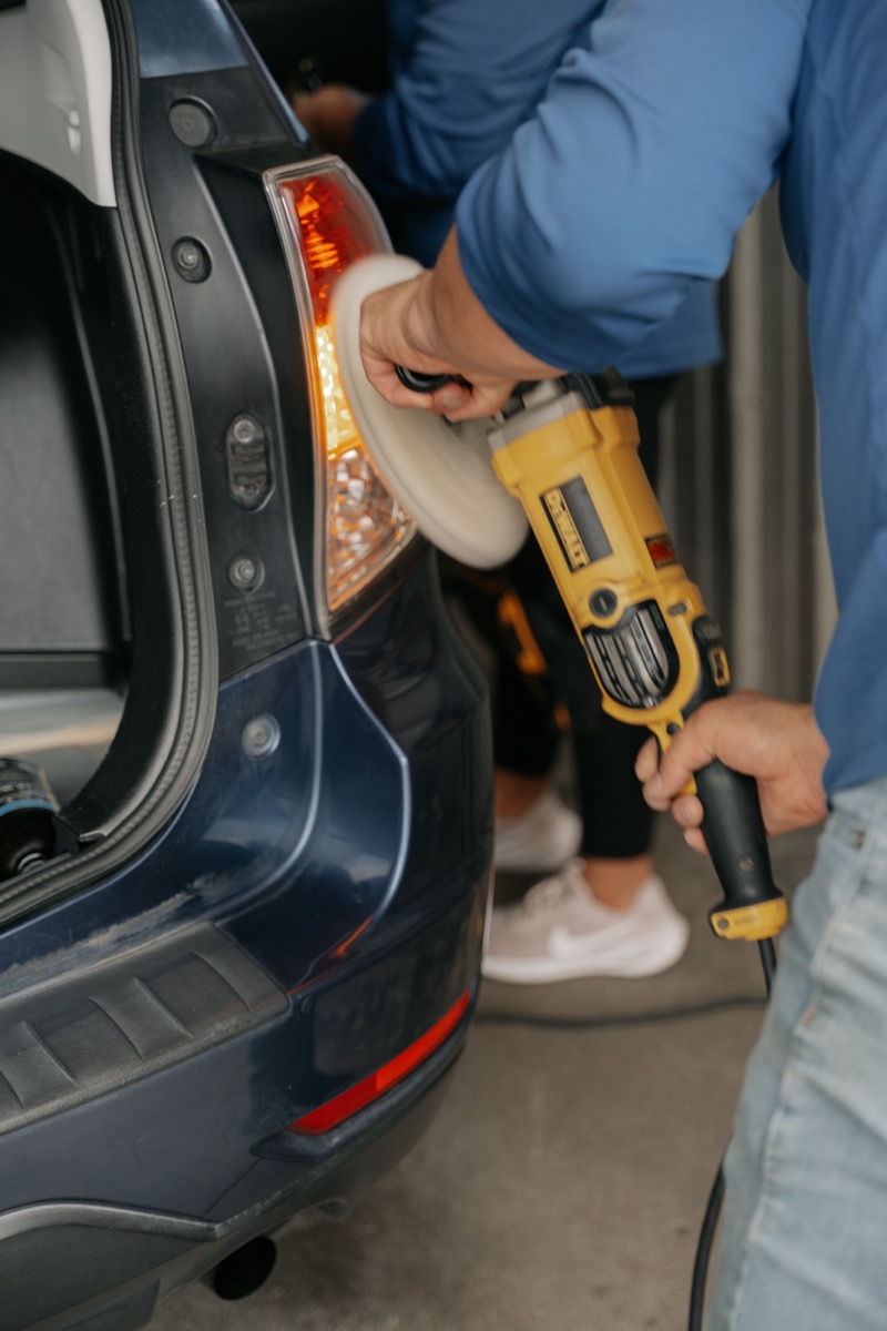 Owner of New Delta Auto Detailing hand-detailing a vehicle in Pullman WA